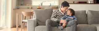 Father and son on couch